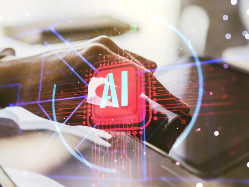 Person using finger on digital tablet with 'AI' superimposed over the top in red