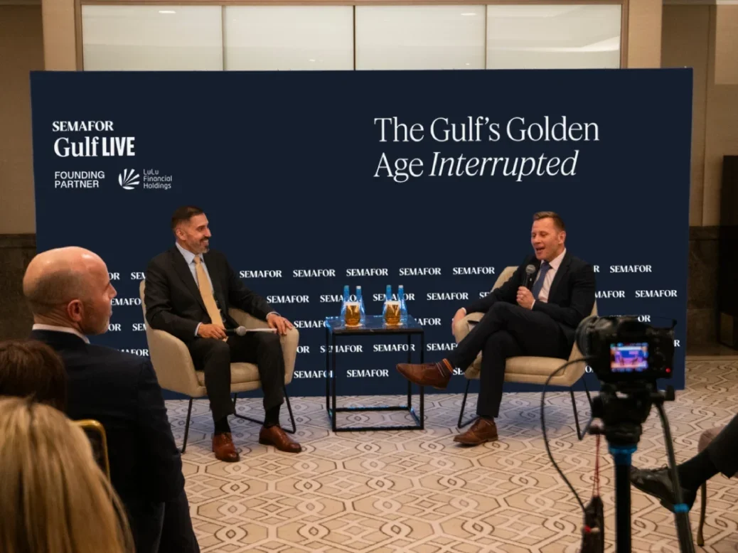 Mohammed Sergie, editor of Semafor Gulf and Matthew Martin, Semafor’s Saudi Arabia bureau chief and global head of sovereign wealth fund coverage, at a Semafor Gulf event sitting on chairs with Semafor Gulf branding behind them with a sense of an audience just in front of and behind the camera